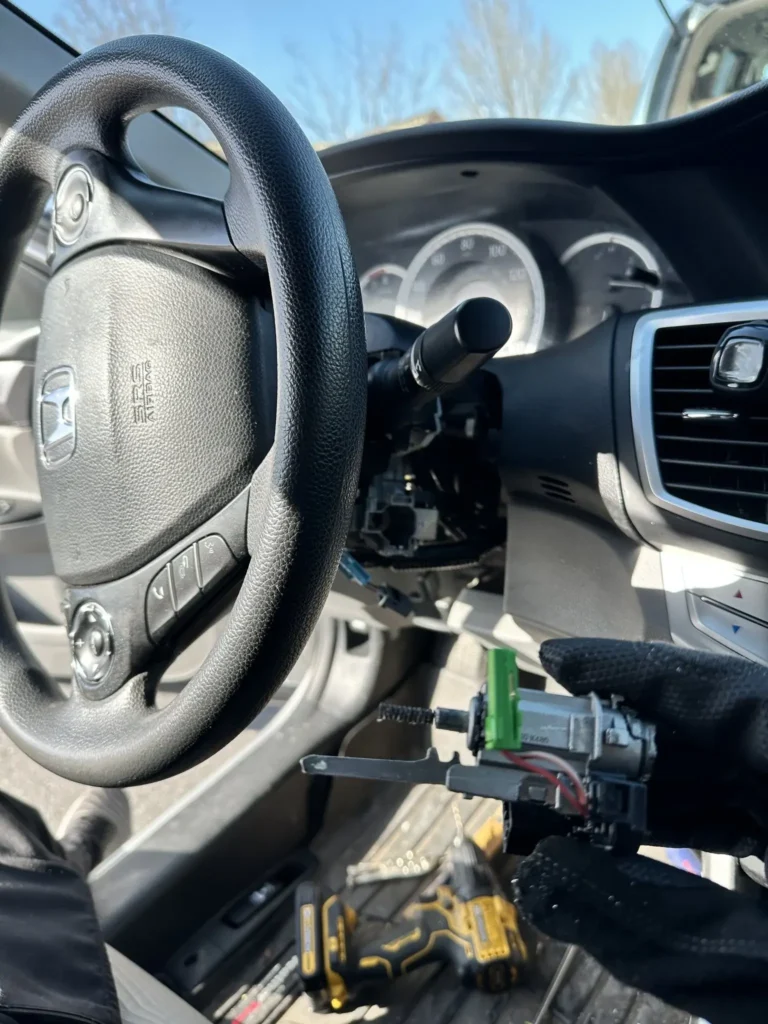Tools near a vehicle steering wheel and ignition