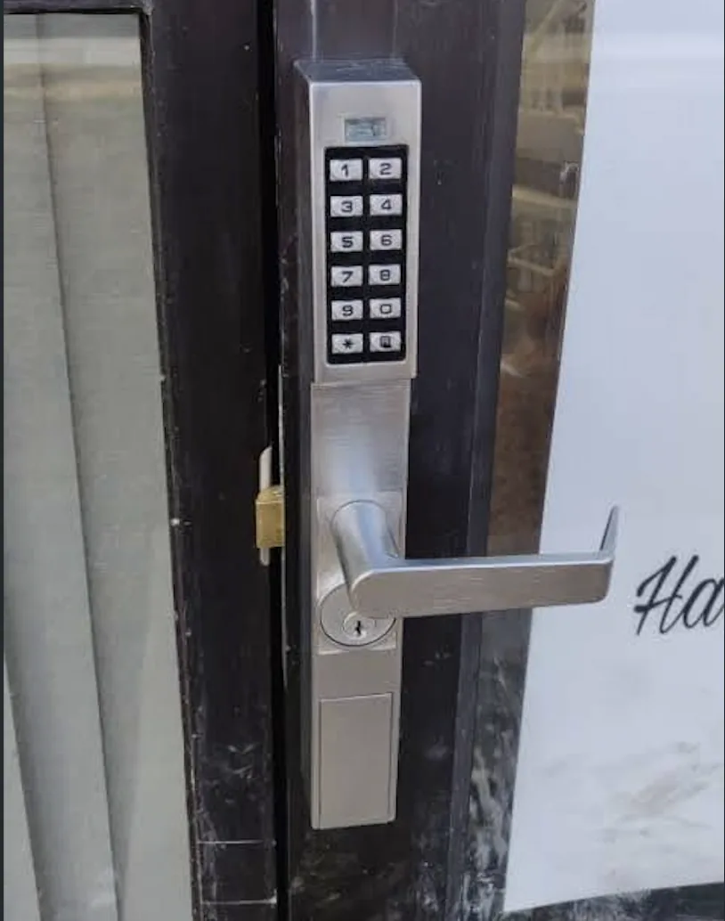 Keypad lever lock on a commercial glass entry door