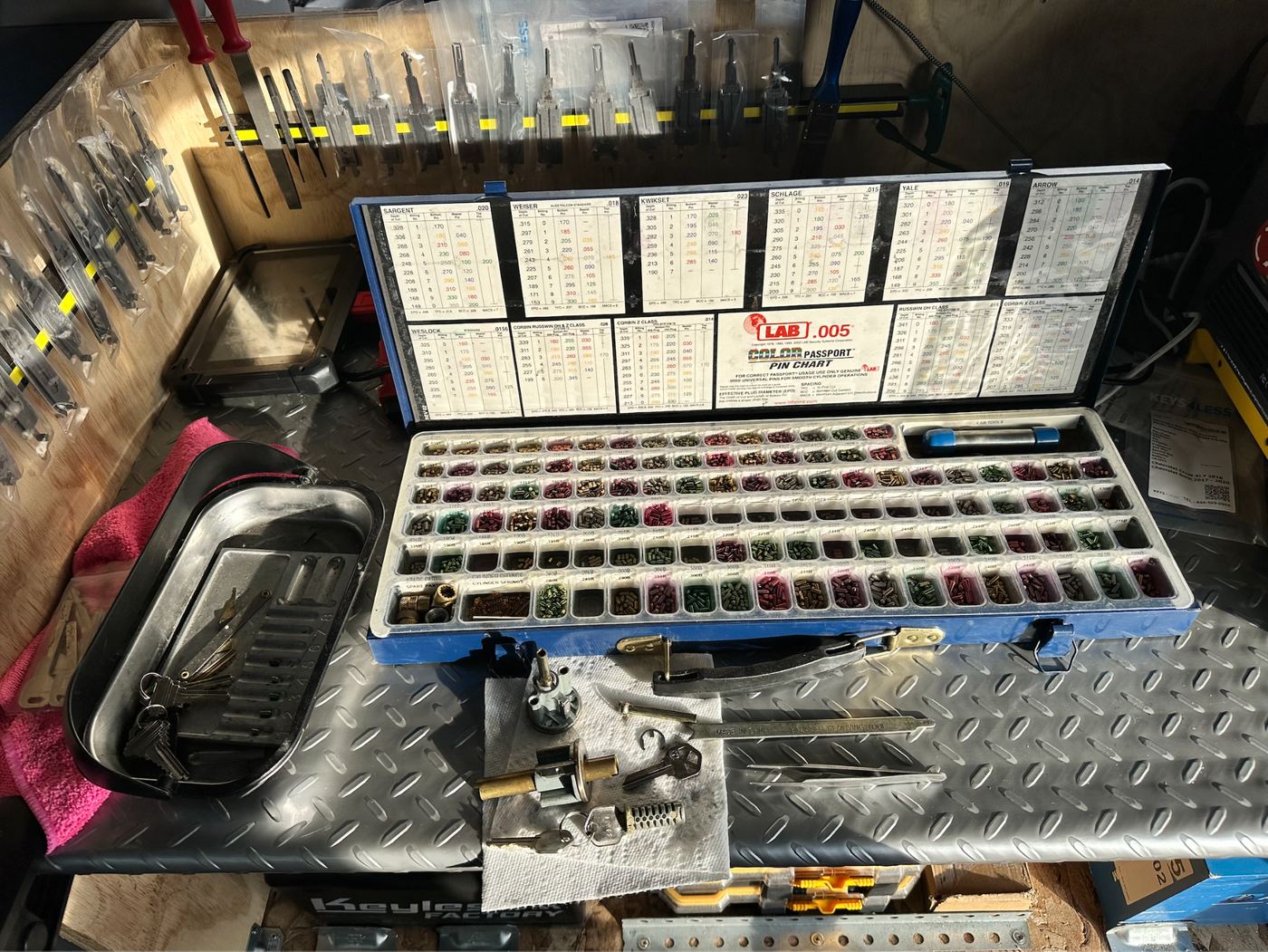 Lock rekeying pin kit and locksmith tools in mobile workshop