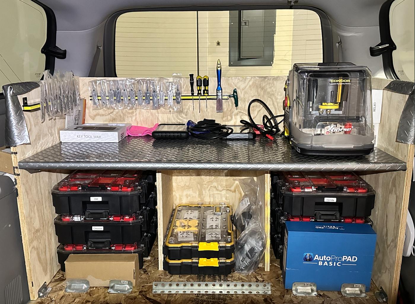 Tools and key cutting machine inside the Locksmith IC mobile service van